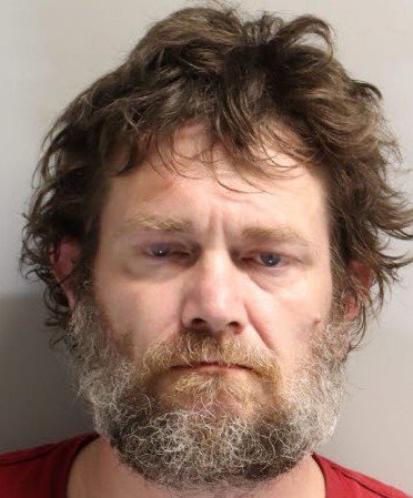 Man Arrested in Tallahassee Homicide After Body Found in Wooded Encampment
