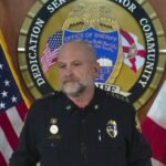 Undersheriff Shawn Coarsey announcing the arrests