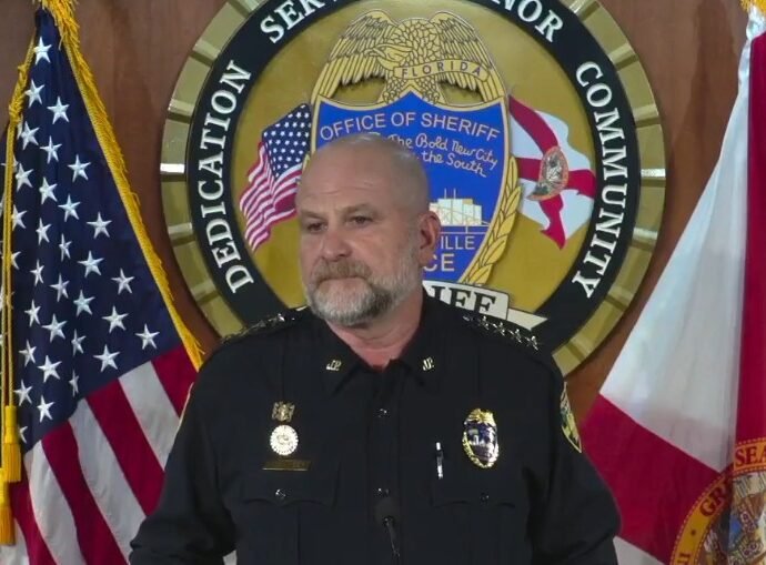 Undersheriff Shawn Coarsey announcing the arrests