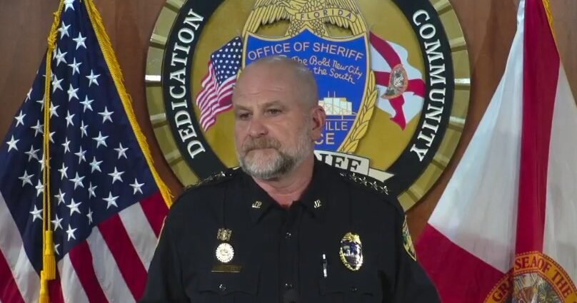 Undersheriff Shawn Coarsey announcing the arrests