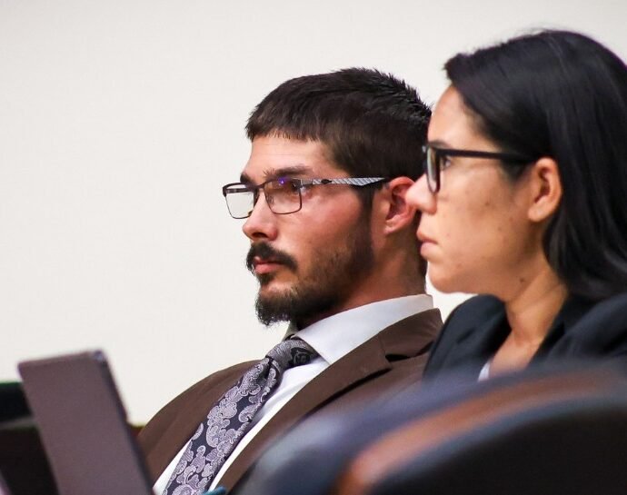 Defendant Justin Cobb in court with lawyer