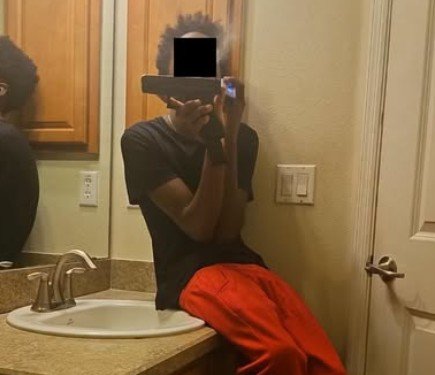 Accused Teen showing gun on photo sent to another