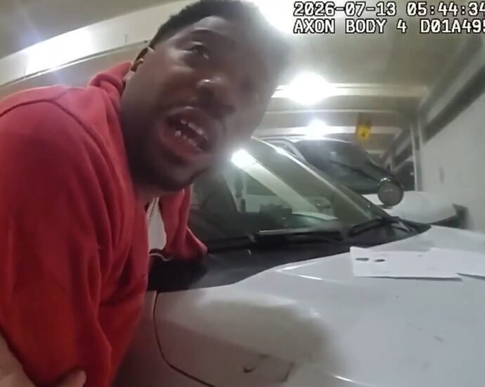Arrest of Griffin, just before the officer hits him while handcuffed